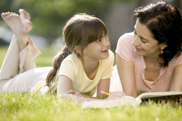 Mother Helping Daughter with Her Homework