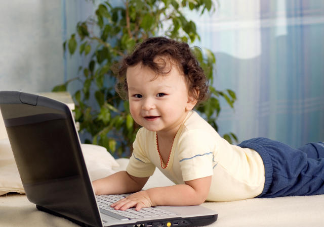 toddler exploring latptop