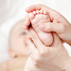 massaging babys feet