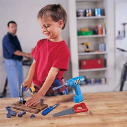 boy playing with pretend play tool set