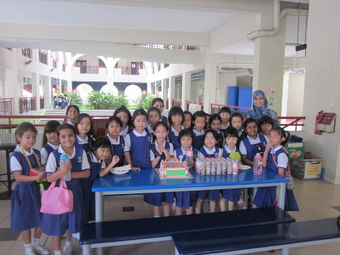 Liv, with her Teacher Mdm Hana and her classmates