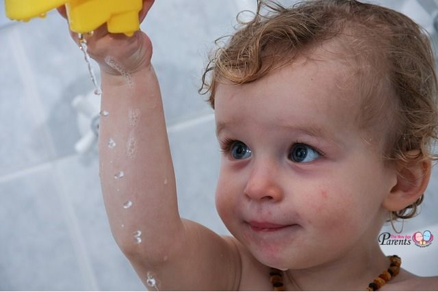 baby playing with water eczema