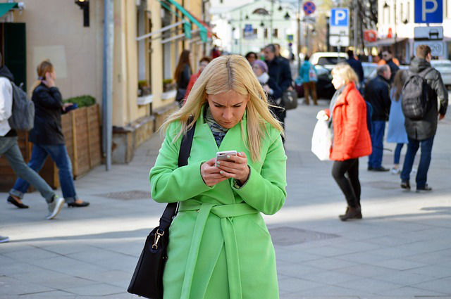 woman addicted to smartphone