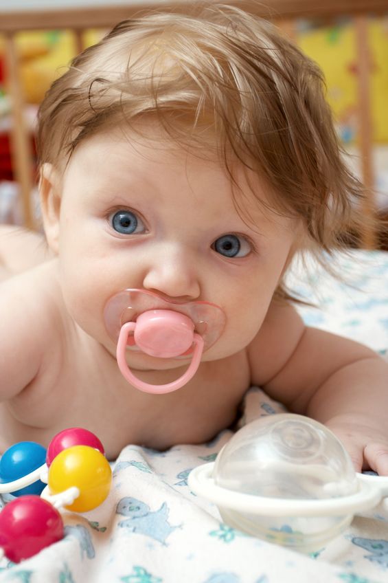 baby sucking on pacifier