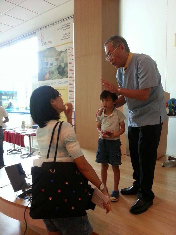 Dr Lim Swee Teck speaking to a parent