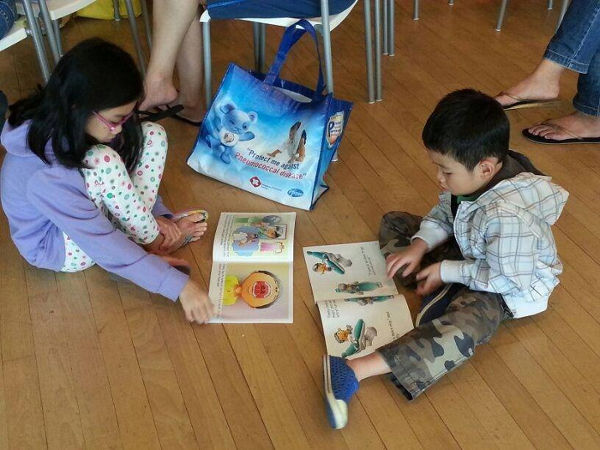 children reading the healthy smile series book