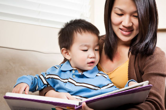 Mother reading to her child