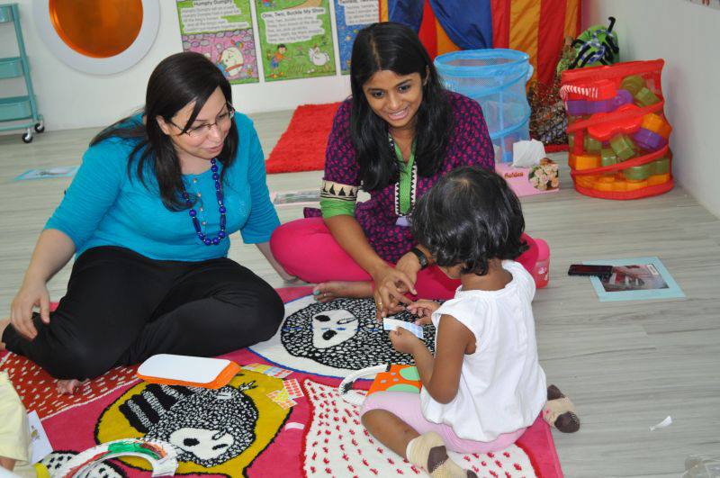 Ms Pooja, with a parent at Kiddiwinkie SchoolHouse