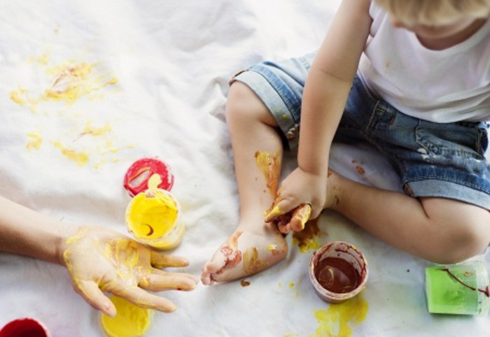 Child playing with paint