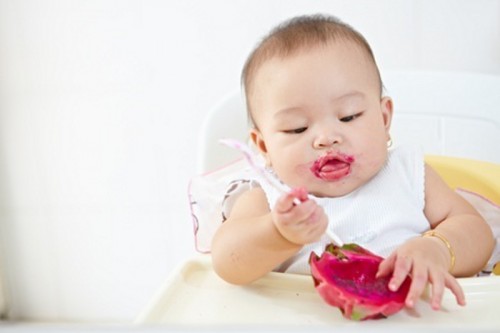 Baby feeding himself