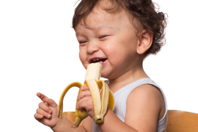 Child eating banana