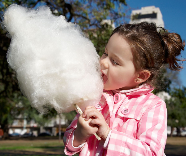 child eating cotton candy