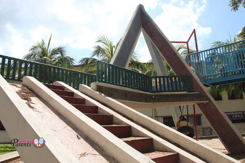 vintage pyramid and slide playground