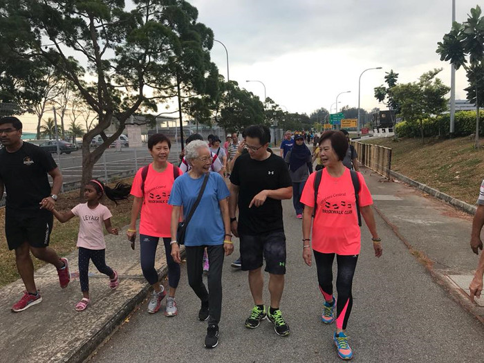 Desmond Choo walking with residents