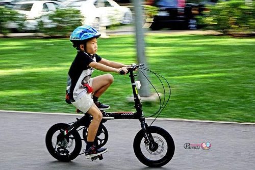 kid cycling exercising