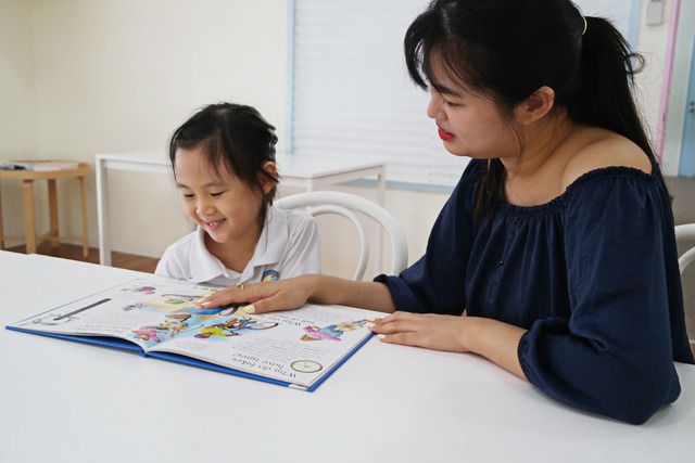 Interaction between teacher and child at Melodious Cove