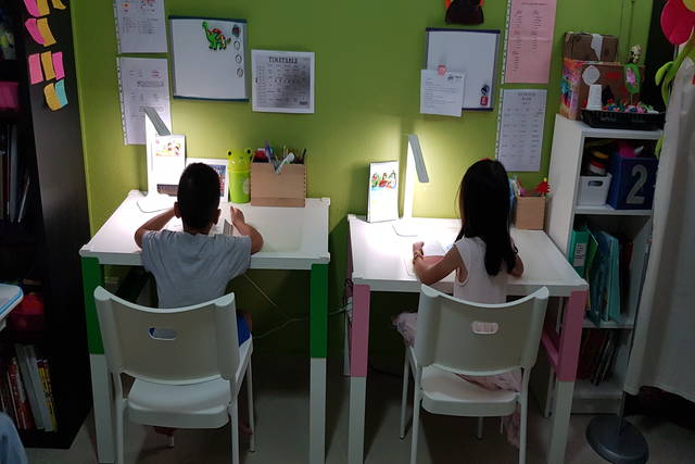 Children studying at desks