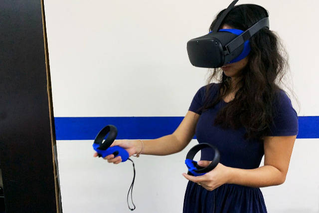 member of Beat The Heat Singapore demonstrating the VR gameplay