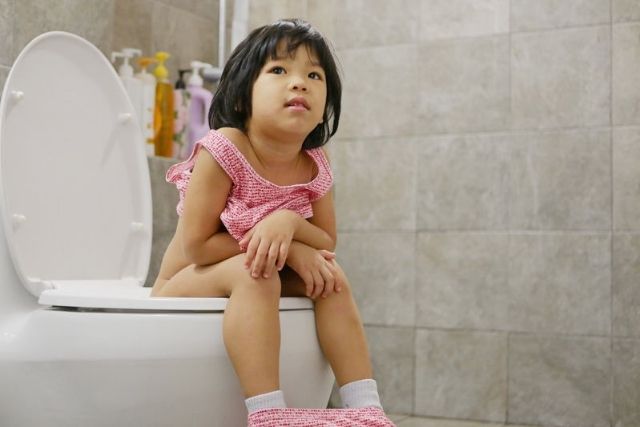 girl drinking enough water toilet break