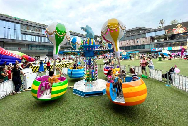 Family fun at carnival rides at Our Tampines Hub