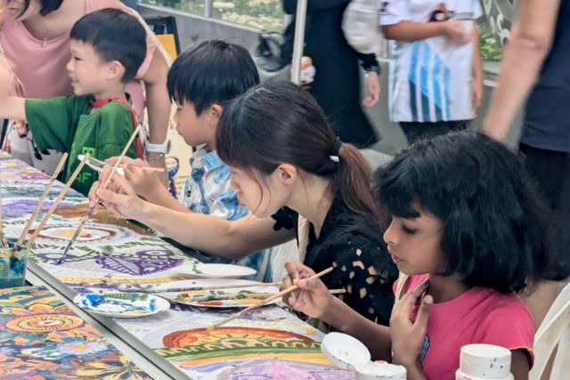 Kids and parents taking part in crafts National Day Our Tampines Hub