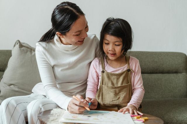 mother tutoring daughter