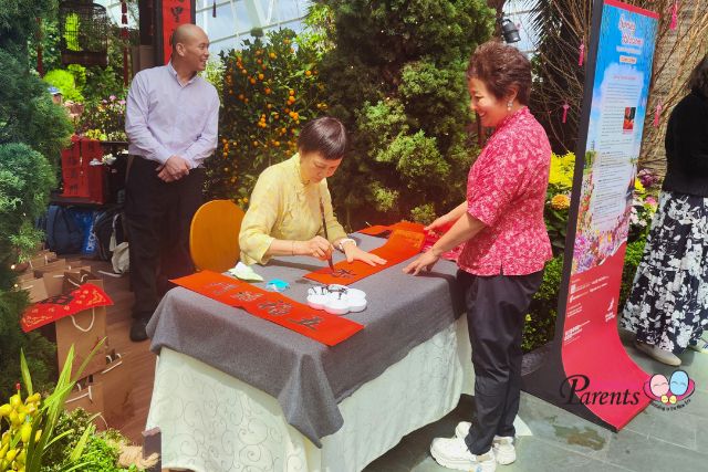 Calligrapher writing spring couplets