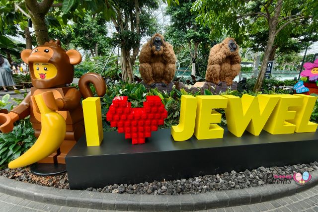 Discover LEGO builds among topiary displays